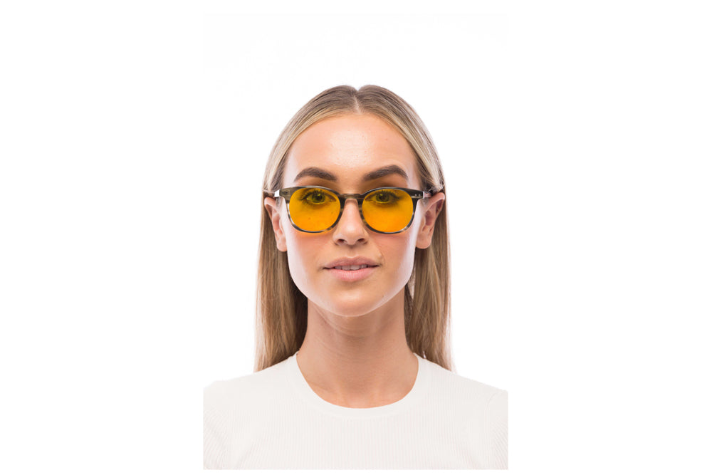 Woman Wearing Arrow Light Sensitivity Glasses