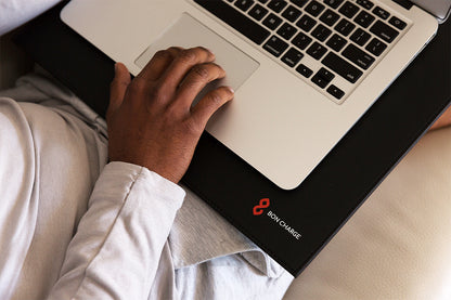 Man Using EMF Radiation Blocking Laptop Mat Under Computer