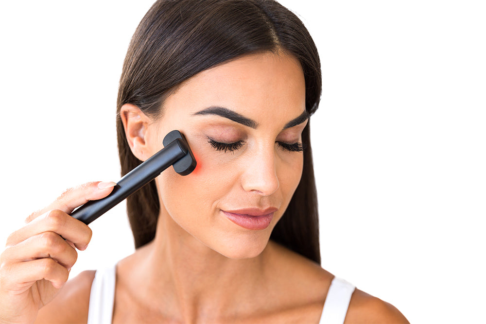 Woman Using Red Light Face Wand