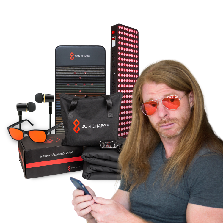 Man wearing red-tinted glasses with Bon Charge products including a blanket, pillow, and blue light blocking glasses displayed.